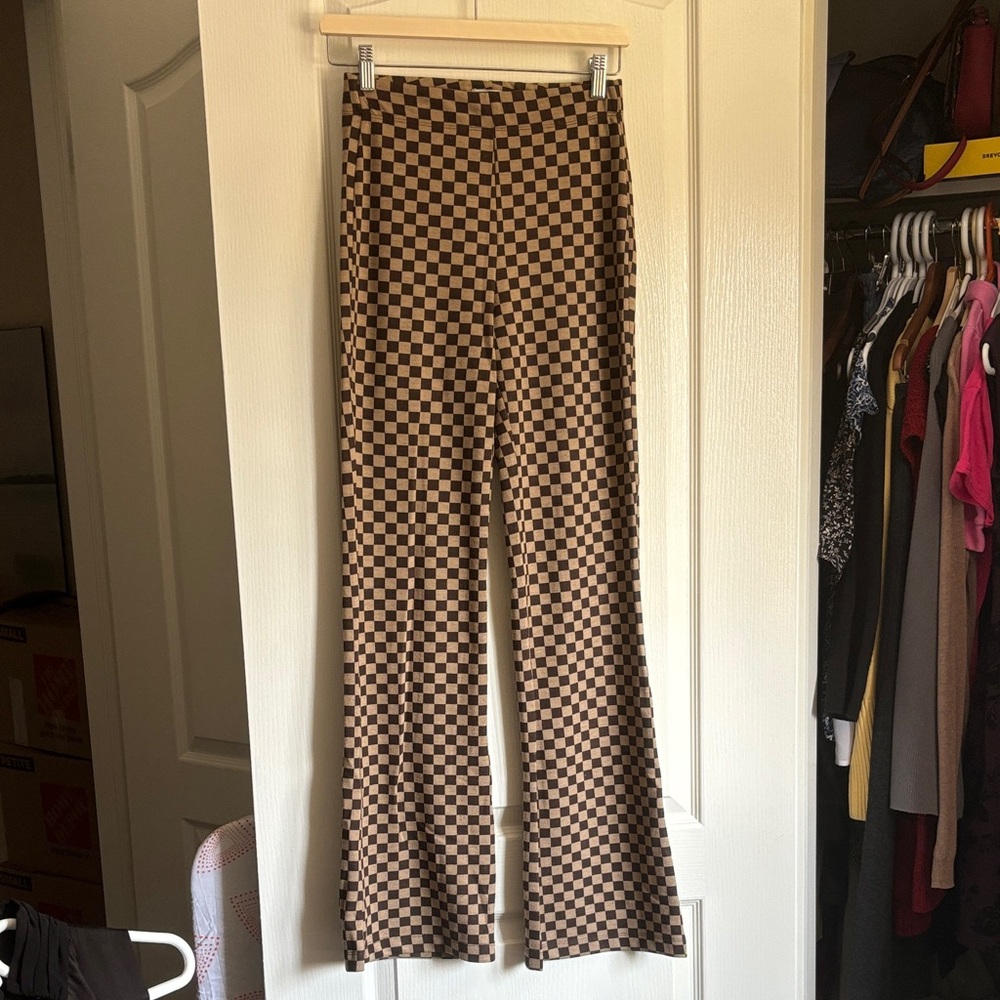 Urban Outfitters retro/disco-style leggings featuring brown patterning.